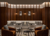 A modern lounge with a white sofa, round tables, and cushioned chairs on a patterned floor. Wooden wall panels and framed artworks enhance the ambiance.