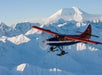 A wide view of the plane flying over Otter Mountain in Talkeetna, Alaska.