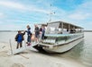 Tourists walking off of The Explorer cruise boat on the Murrells Inlet Bird Watching Eco Tour.