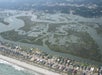 Aerial view looking down on Murrells Inlet Garden City  on a sunny day.
