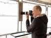 A man taking photos on the Explorer at Murrells Inlet Bird Watching Eco Tour 