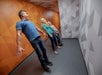 Family tilting at Museum of Illusion in Orlando 