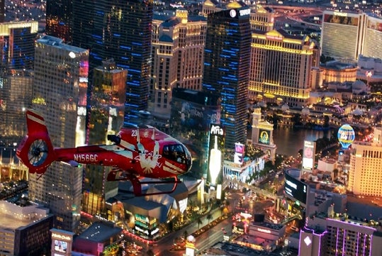 Helicopter flying over Las Vegas on the NEON Night Flight Spectacular in Las Vegas Nevada.