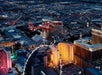 The helicopter with the city in the background on the NEON Night Flight Spectacular in Las Vegas Nevada.