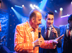 A comedian in an orange jacket at the New South Gospel show in Branson, MO.