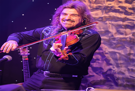 A man playing the fiddle at the New South Gospel show.