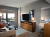 Seating area, sofa, flat-screen TV at New York Hilton Midtown, NY.