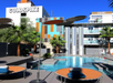 Outdoor pool with poolside lounge area.