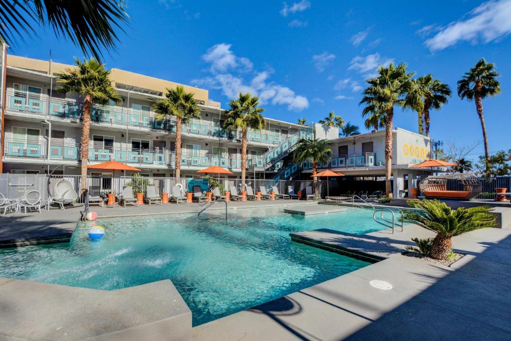 Outdoor pool with sun loungers.