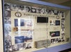 A display of the Pearl Harbor remembrance ceremony on 80th anniversary of attack with black and white photos of the men who died that day around it.