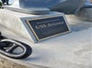 Close up of the bronze and black plaque for the USS Arizona anchors on the Official USS Arizona Narrated Tour.