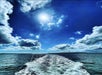 A view from the back of the boat during parasailing.