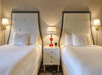 Two queen beds inside a guest room.