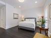 One king bed with plush bedding inside a non-smoking room.