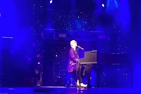 A rock star at the piano.