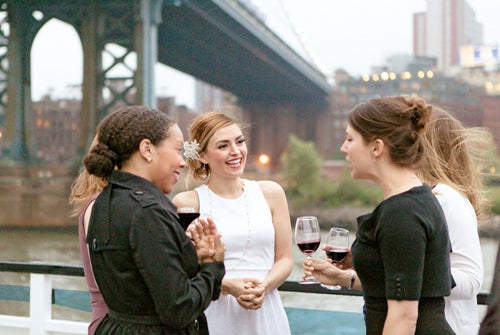 Group of friends enjoying the view at NYC Harbor Dinner Cruise by Hornblower