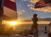 Group enjoying sunset views on a catamaran with Pink Sails Waikiki.