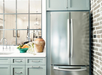 Modern kitchen with a full-sized refrigerator, and sink