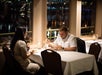 A couple looking over the menu while on the Dinner Cruise on Portland Spirit, Portland, Oregon.