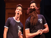 Two people wearing matching black shirts labeled "Potter 1" and "Potter 2" perform on stage; one looks surprised, the other has a large fake beard.