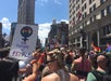 Streets crowded with a pride parade on the Pride Walking Tour in Manhattan, New York, USA.