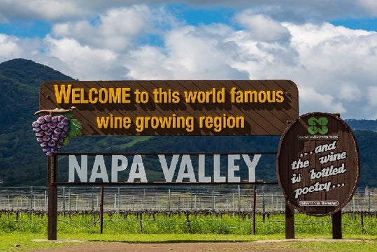 A sign welcoming guests to the world famous wine growing region of Napa Valley