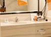 Guest bathroom with free toiletries, a coffee maker, and a hairdryer.