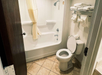 Guest bathroom with a tub and shower combination.
