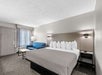 Relax in comfort with a king bed and a cozy sofa for extra space.