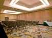 A spacious and carpeted meeting facility.