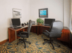 Business center with two desktop computers and a printer.