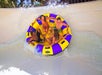 Big-raft splash moment on a twisting water slide.
