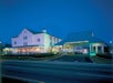 View of the Ramada Pigeon Forge North by Wyndham from the road at night.