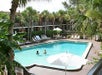 Heated Pool surrounded by lush tropical garden.