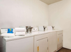 Guest laundry area with washing machine and dryer.