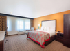 1 King bed inside a guest room.