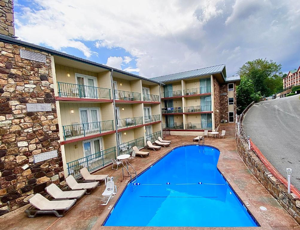 The outdoor pool offers a tranquil setting for swimming or lounging under the open sky.