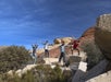 The group climbing through some rocks on the Red Rock Canyon Tour - Pink Jeep Tours in Las Vegas, Nevada