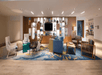Lobby with comfortable seating area and flat-screen TV.