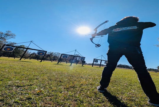 Aiming toward victory at the Revolution Adventures hub.