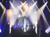 Reza and cast do a magic trick inside of a large metal circle