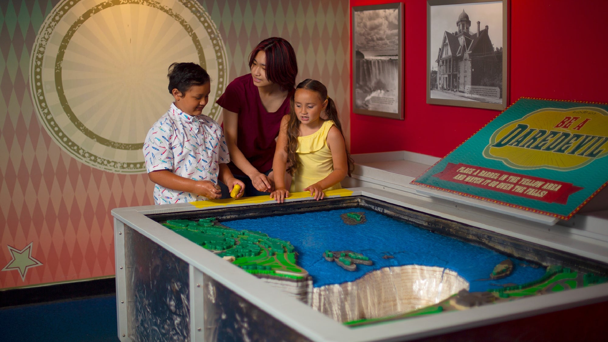 Family playing with the exhibit at Ripley's Believe It Or Not! Niagara Falls.