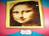 A portrait of Mona Lisa made entirely out of different shades of toast on display at Ripley's Believe It or Not! Orlando Odditorium.