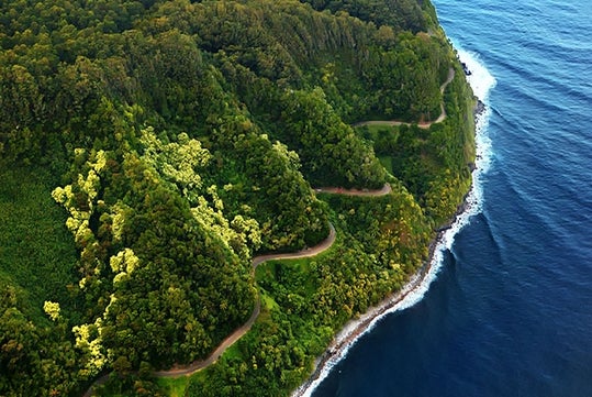 The Highway to Hana from the sky within the lush greenery on the Road to Hana tour in Maui Hawaii, USA.