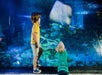 Two young boys pressed to the glass looking at the underside of a sting ray at SEA LIFE Michigan in Auburn Hills, Michigan.