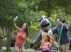 Guests take a photo with rhinoceros character