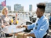 Two person enjoying the view of San Diego’s sights at San Diego Brunch Cruise