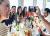Group of friends enjoying the food and drinks at San Diego Brunch Cruise in San Diego, California
