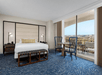One king bed inside a guest room with view.