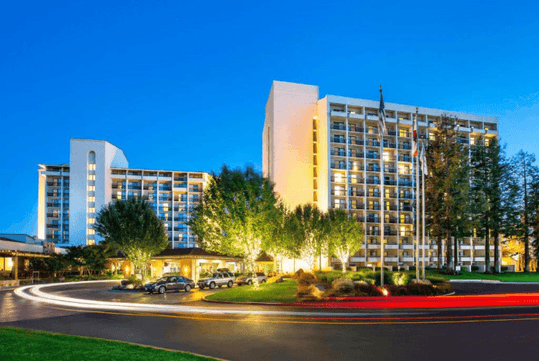 Hotel exterior at night.